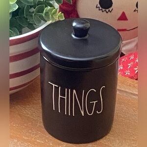 Rae Dunn black “THINGS” jar with lid. 5” tall. 3 5/8” in diameter.